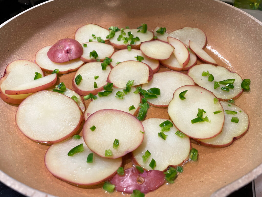 Sliced Red Potatoes in Frying Pan