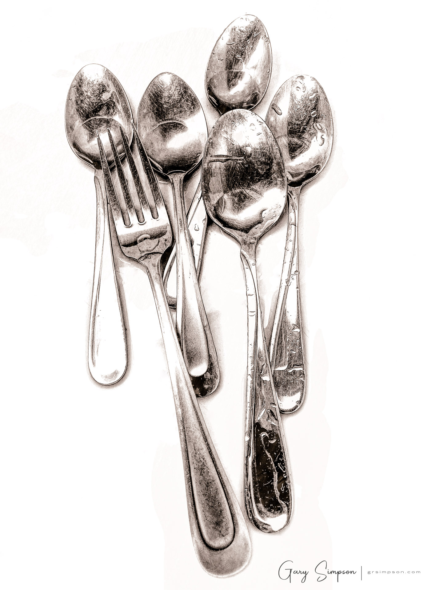 Black and white photograph of silver spoons and a fork